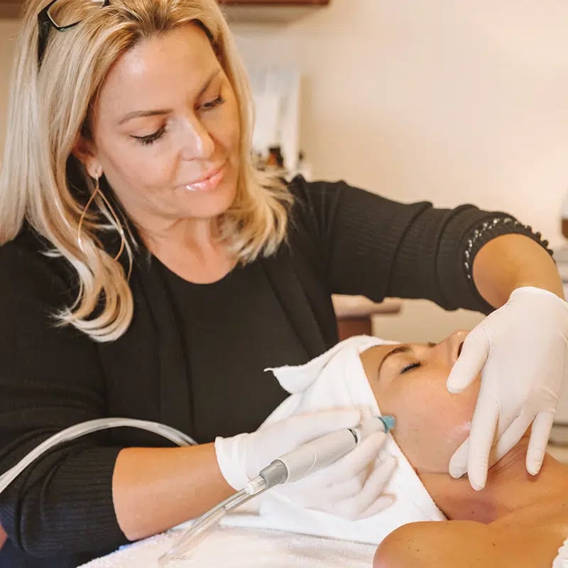 Female patient receiving Black Diamond Lift & Glow Hydrafacial