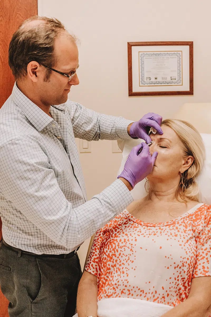 Female patient receiving fillers and collagen stimulators