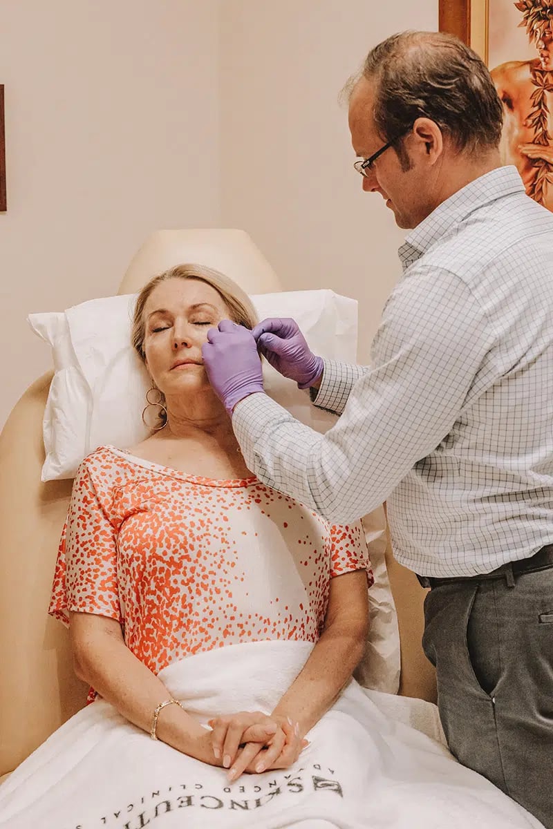 Middle-aged woman receiving neuromodulators