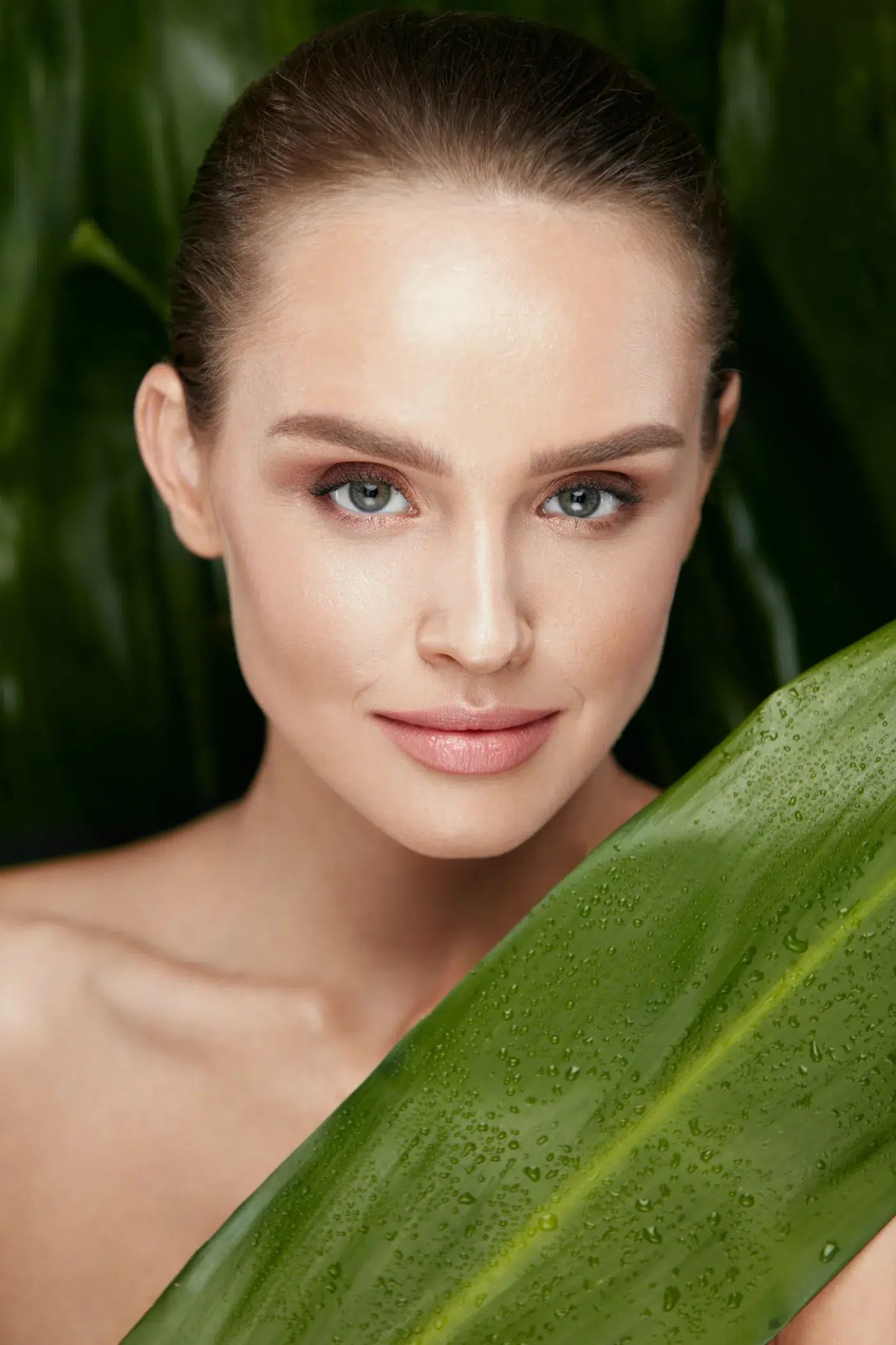 pretty woman with a leaf hydrafacial