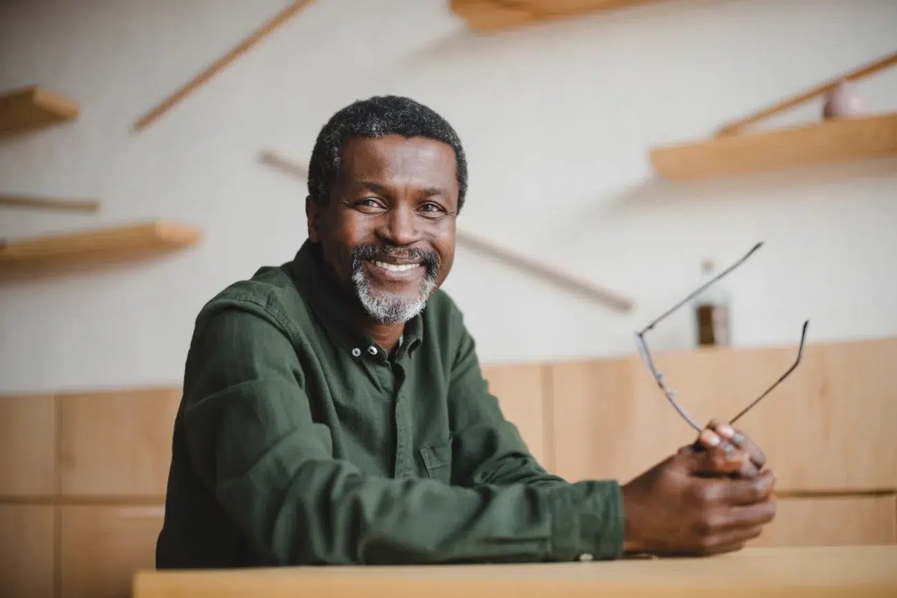 smiling older black man with glasses