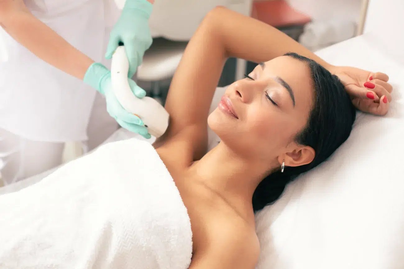 woman getting laser hair removal treatment on her armpit