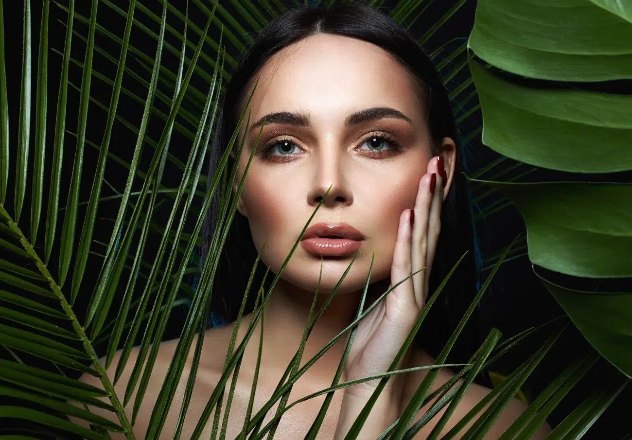 stunning woman surrounded by leaves