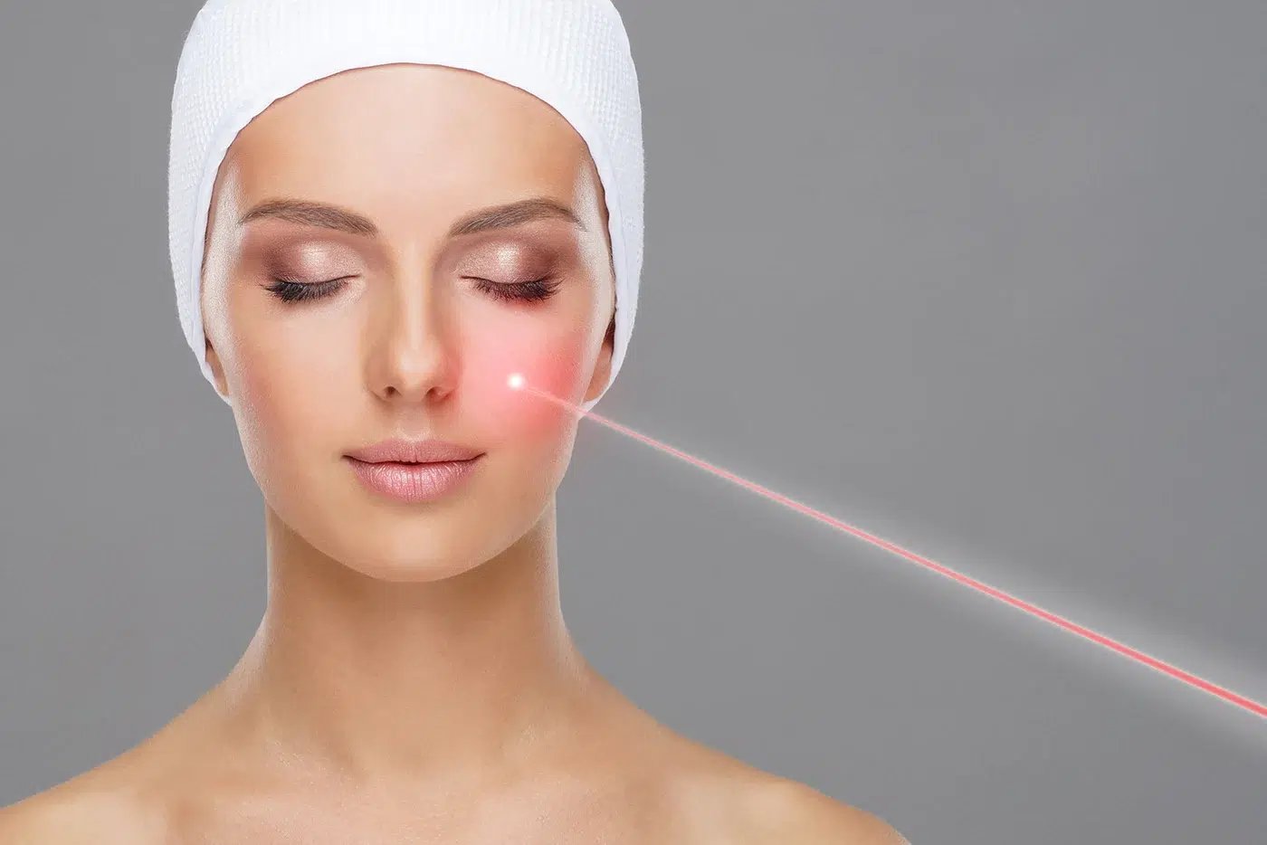 Woman receiving laser treatment for skin rejuvenation.