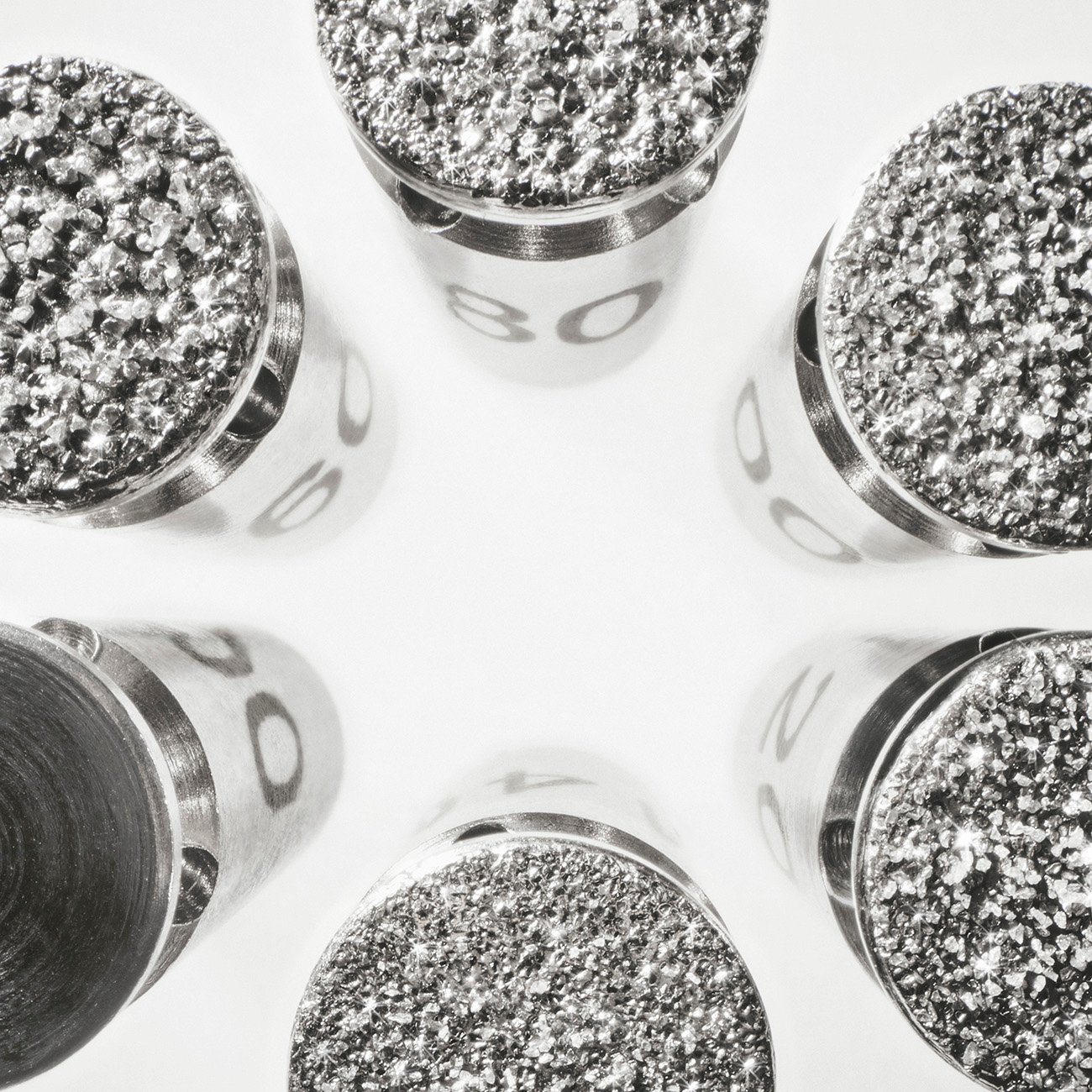 Close-up of sparkling diamond microdermabrasion tips, numbered 80.